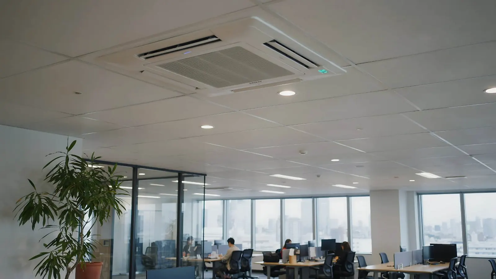 Daikin ceiling cassette cooling an open-plan commercial office with skyline views