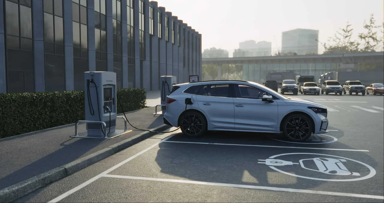 Electric car charging in a marked EV bay outside an office building