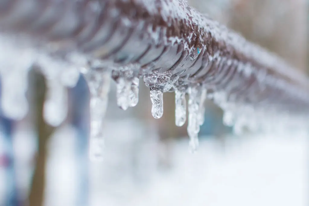 Frozen condensate pipe with ice buildup causing boiler breakdown - common cause of emergency boiler repair in Scottish winter