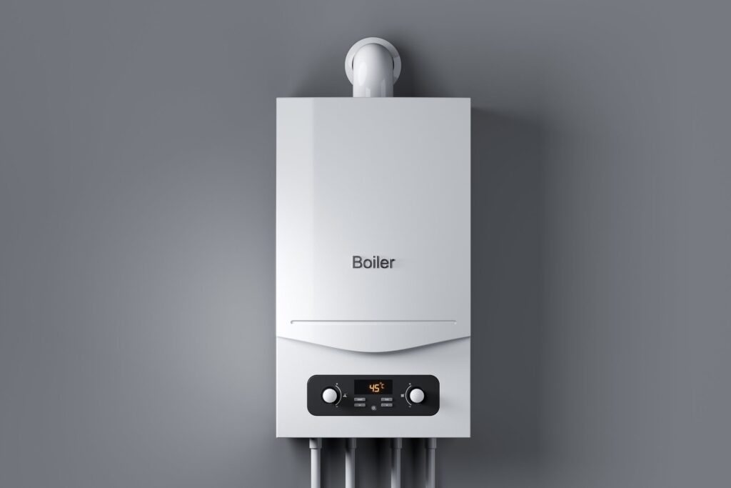 Modern white combi boiler with digital display showing when to replace your boiler for improved efficiency